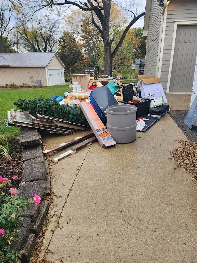 Dumpster being loaded with debris for Commercial Dumpster Rental in Peru